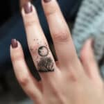 Moon on Finger Tattoo Meaning & Symbolism (Balance)