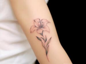 The Significance of Lily Tattoo Meanings + Designs