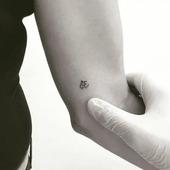 Minimalist Om Tattoo